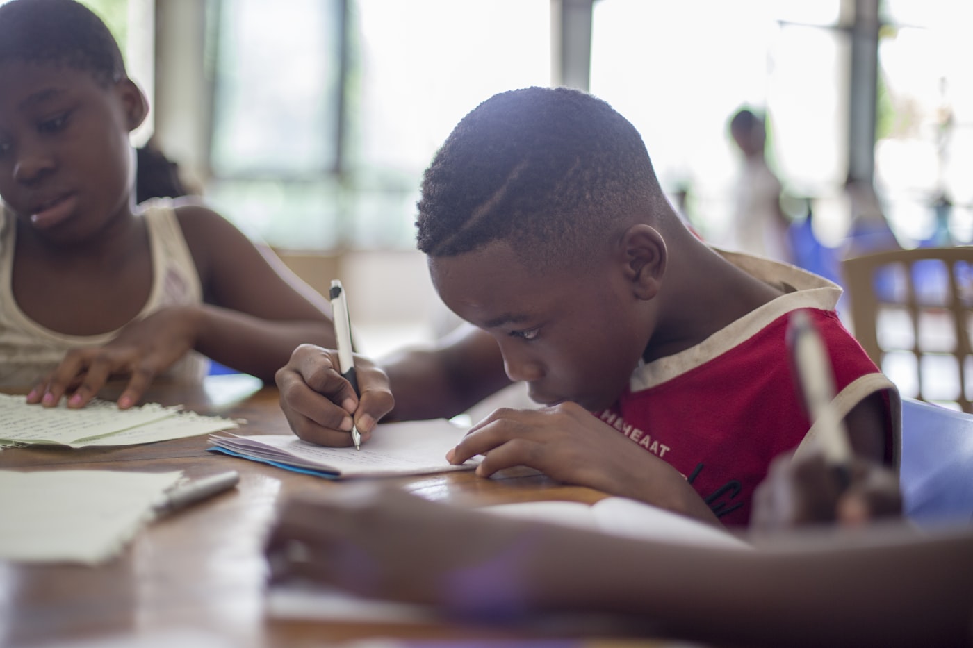 Two young people concentrating on their work