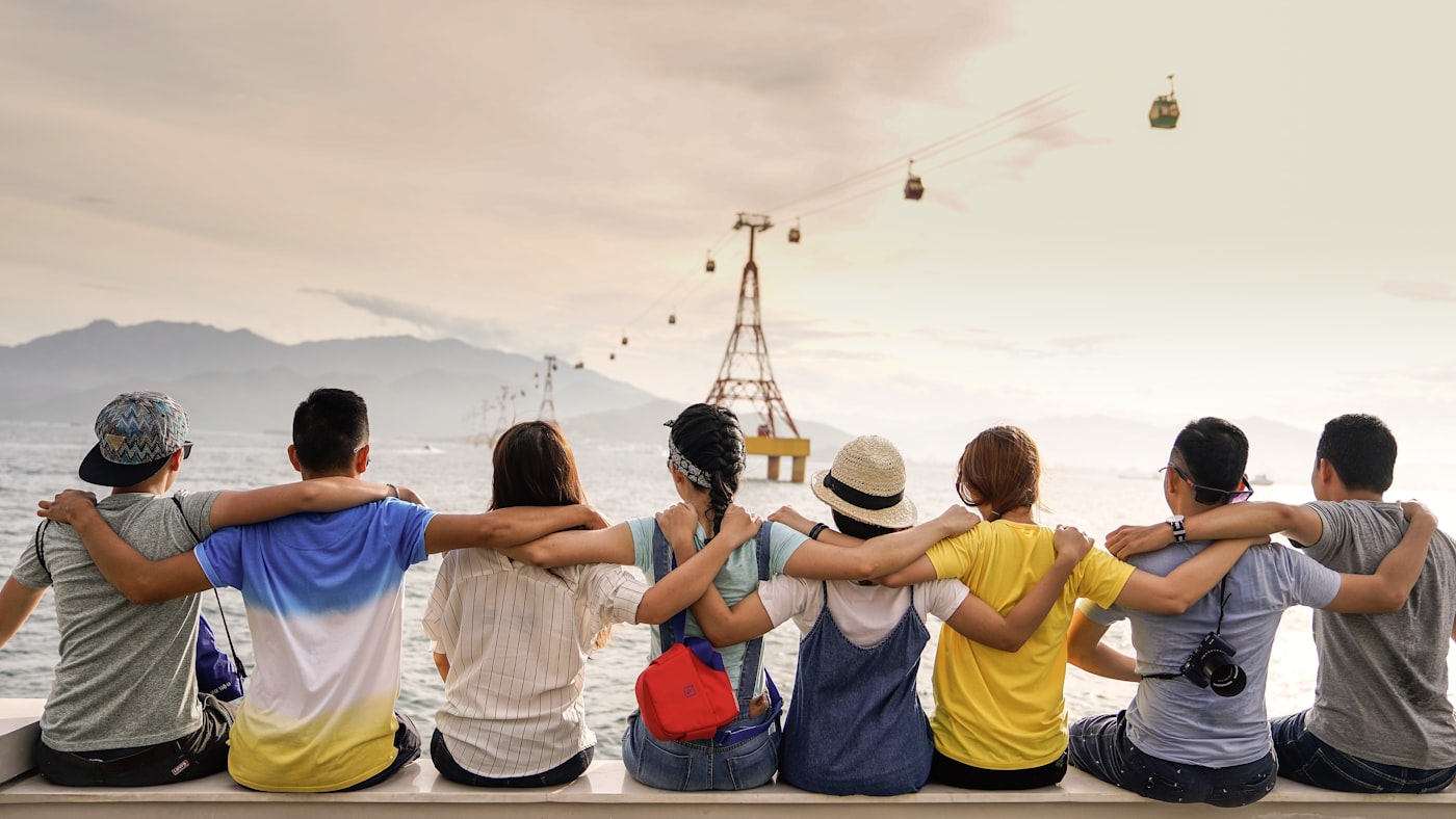 A group of friends arm in arm